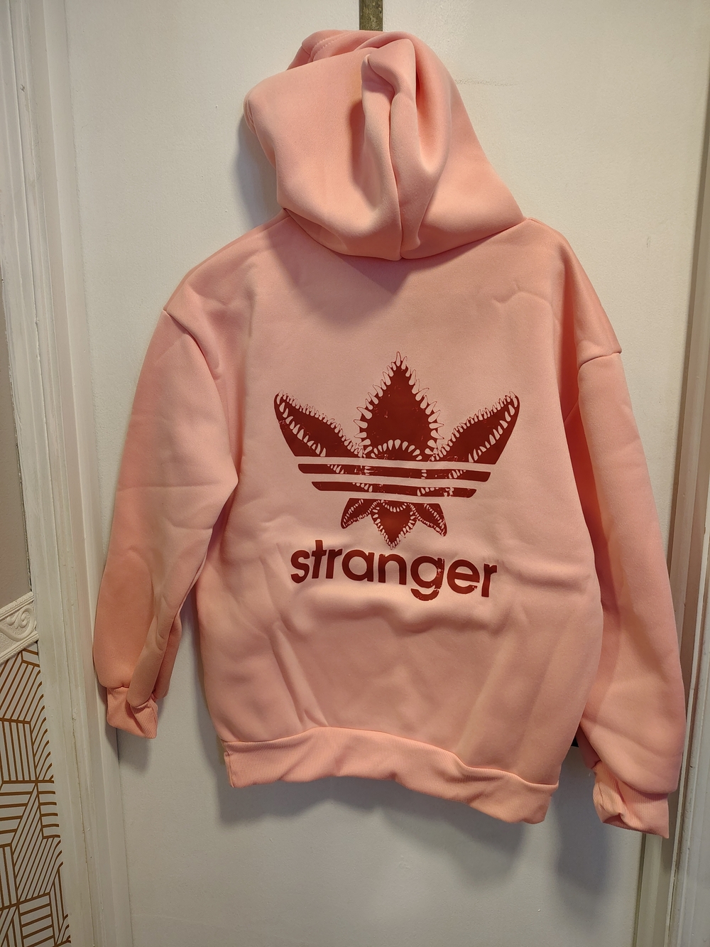 Pink 'Stranger' Graphic Hoodie with Leaf Logo